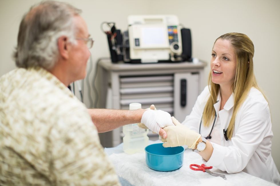 nursing student treating patient
